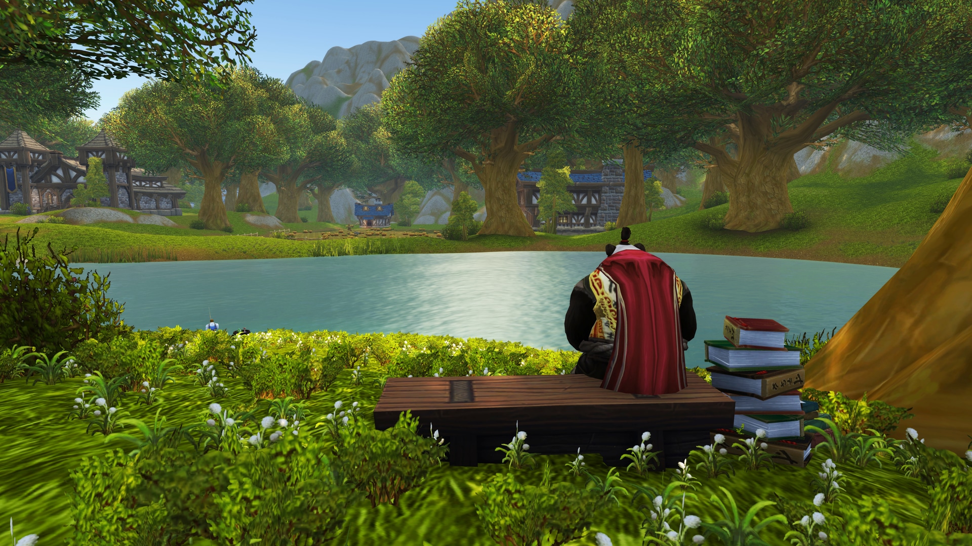 Un pandaren sentado en un banco mira hacia un estanque cercano con un montón de libros a su lado