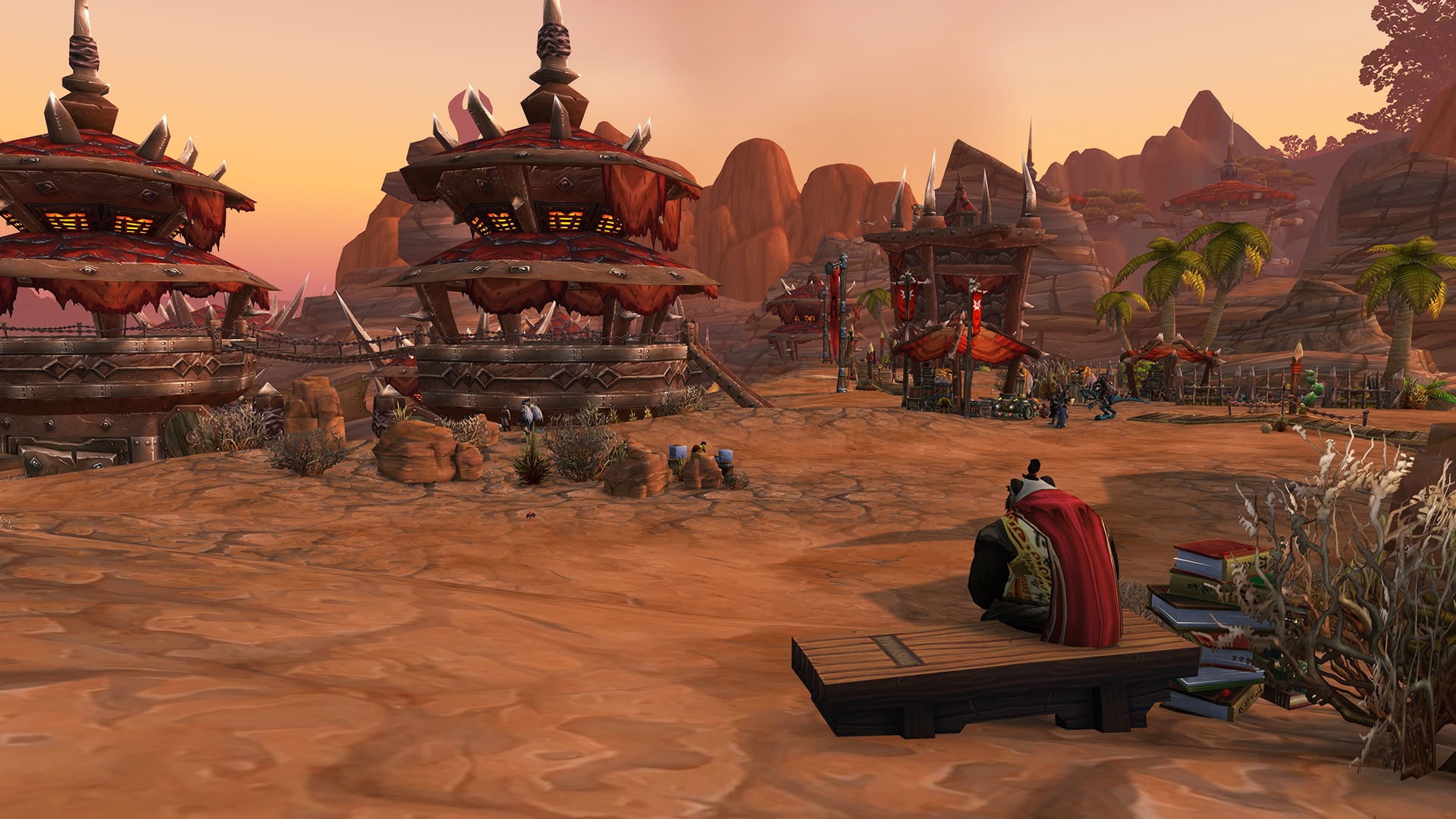 Un pandaren sentado en un banco frente a las torres de vuelo